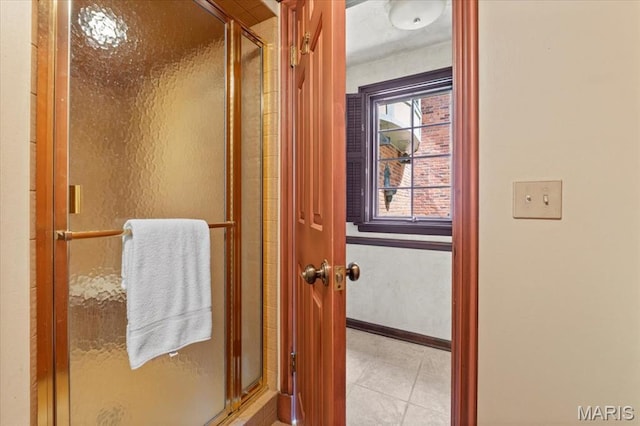 13596 Kings Glen Dr, Saint Louis, MO 63131 - full bathroom featuring a stall shower, tile patterned flooring, and baseboards
