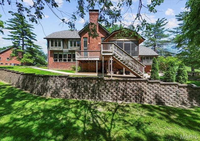 13596 Kings Glen Dr, Saint Louis, MO 63131 - rear view of house with a sunroom, stairway, brick siding, a lawn, and a chimney