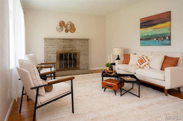 2917 Grand Ave, Granite City, IL 62040 - living area featuring wood finished floors and a stone fireplace