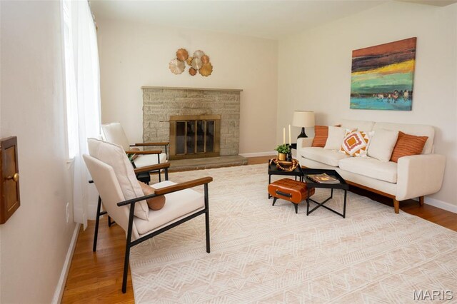 2917 Grand Ave, Granite City, IL 62040 - living area with wood finished floors and a stone fireplace