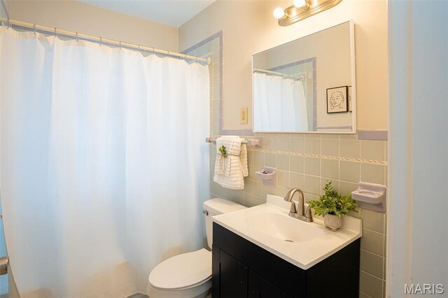 2917 Grand Ave, Granite City, IL 62040 - bathroom with vanity, tile walls, and a shower with shower curtain