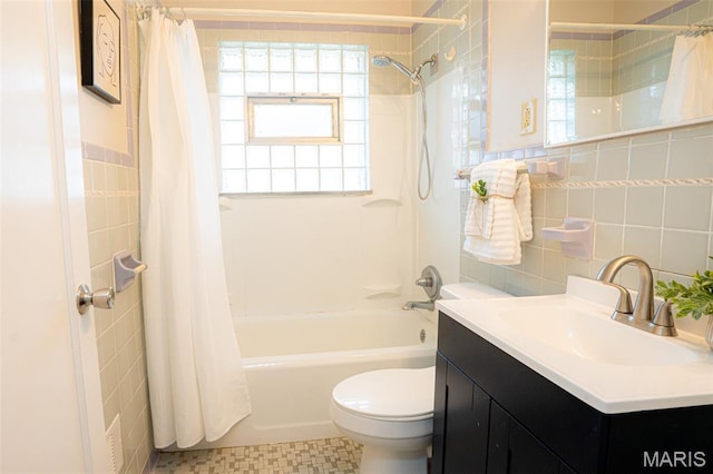 2917 Grand Ave, Granite City, IL 62040 - bathroom with tile walls, shower / bath combination with curtain, and vanity