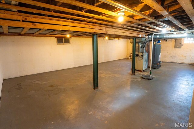 2917 Grand Ave, Granite City, IL 62040 - basement featuring gas water heater, electric panel, heating unit, and concrete block wall