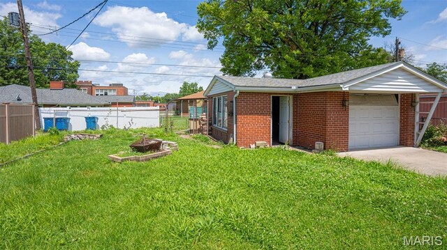 2917 Grand Ave, Granite City, IL 62040 - view of yard with a garage and concrete driveway