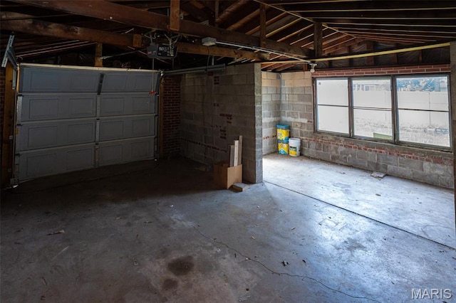 2917 Grand Ave, Granite City, IL 62040 - garage with a garage door opener and concrete block wall