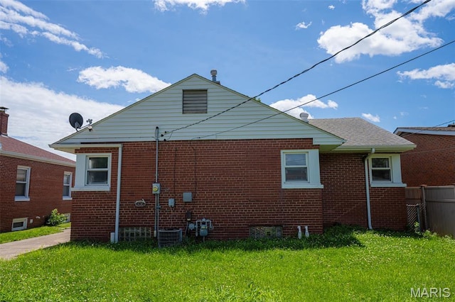 2917 Grand Ave, Granite City, IL 62040 - view of side of property with brick siding and a central AC unit