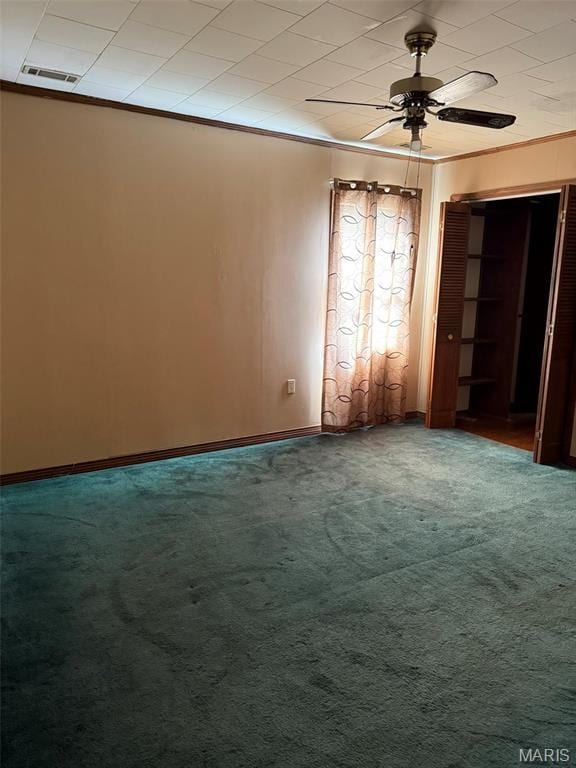 303 N Main St, Campbell, MO 63933 - carpeted spare room with ornamental molding, baseboards, and ceiling fan