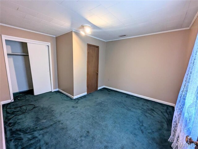 303 N Main St, Campbell, MO 63933 - unfurnished bedroom featuring crown molding, carpet floors, baseboards, and a closet