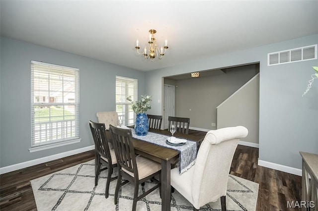 1168 Oak Hollow Dr, Imperial, MO 63052 - dining room with a chandelier, baseboards, and wood finished floors