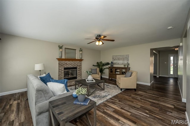 1168 Oak Hollow Dr, Imperial, MO 63052 - living room featuring baseboards, a ceiling fan, dark wood finished floors, and a fireplace