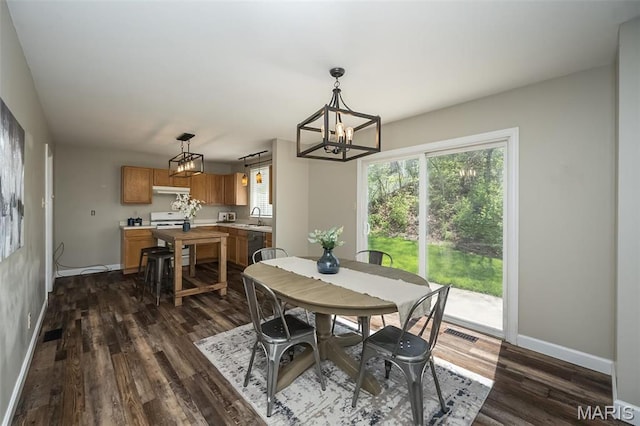 1168 Oak Hollow Dr, Imperial, MO 63052 - dining room with baseboards, a chandelier, and dark wood-type flooring