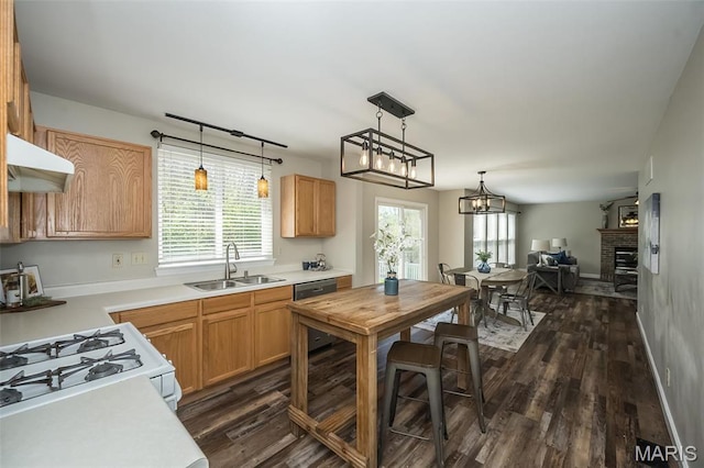 1168 Oak Hollow Dr, Imperial, MO 63052 - kitchen featuring a sink, under cabinet range hood, dark wood-style floors, and plenty of natural light