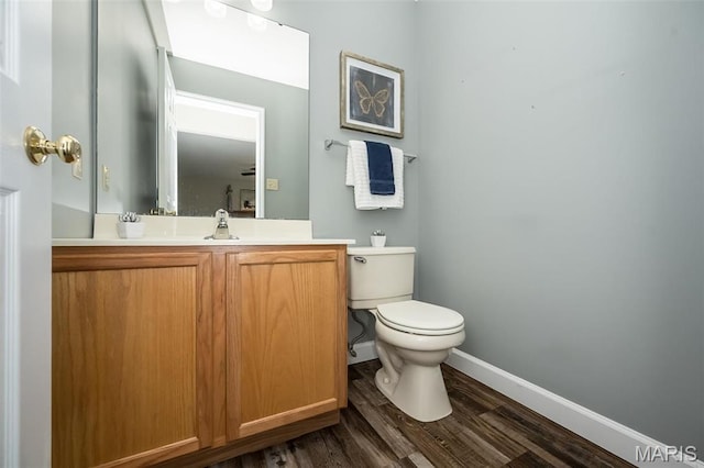 1168 Oak Hollow Dr, Imperial, MO 63052 - bathroom with baseboards, toilet, wood finished floors, and vanity
