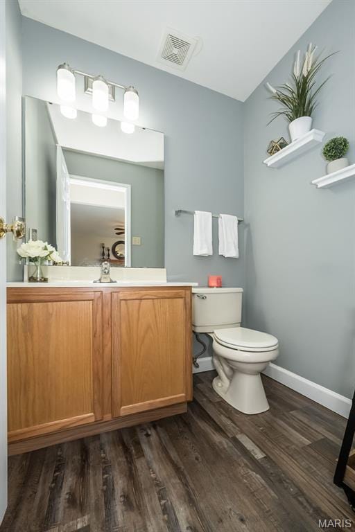 1168 Oak Hollow Dr, Imperial, MO 63052 - bathroom with toilet, wood finished floors, baseboards, and vanity