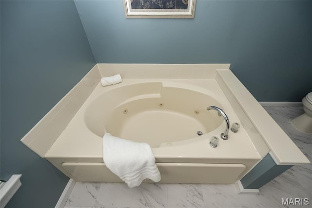 1168 Oak Hollow Dr, Imperial, MO 63052 - full bath featuring marble finish flooring, a whirlpool tub, and toilet