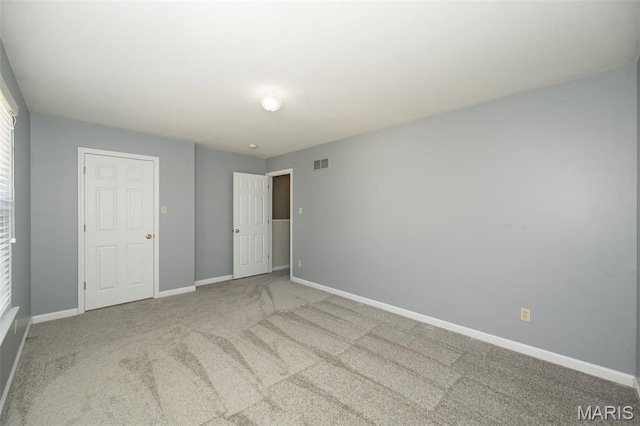 1168 Oak Hollow Dr, Imperial, MO 63052 - unfurnished bedroom featuring baseboards and carpet