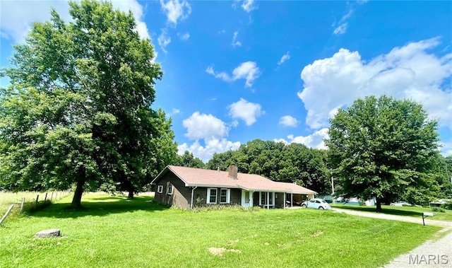 5815 Robin Ln, Troy, MO 63379 - view of front facade with a front yard and a chimney