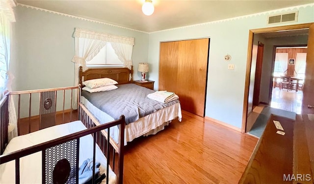 5815 Robin Ln, Troy, MO 63379 - bedroom featuring wood finished floors and a closet