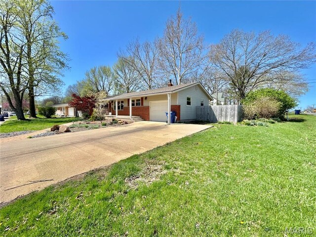 1101 S Mildred Blvd, Salem, MO 65560 - ranch-style house with an attached garage, a chimney, brick siding, and concrete driveway