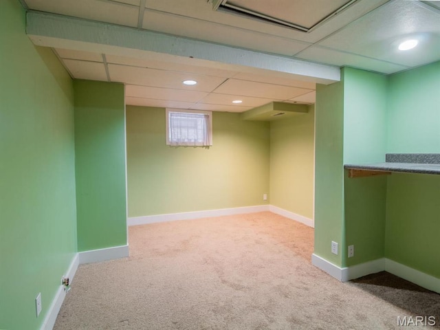 below grade area featuring carpet flooring, baseboards, and recessed lighting