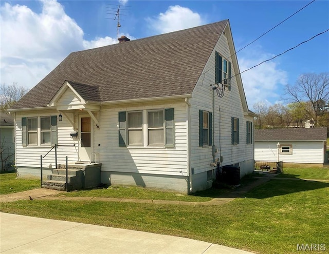 109 N Oak St, Rolla, MO 65401 - view of front of house with roof with shingles, a front lawn, a chimney, and central air condition unit