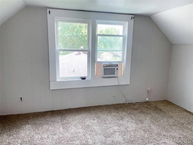 109 N Oak St, Rolla, MO 65401 - additional living space featuring healthy amount of natural light, vaulted ceiling, carpet flooring, wooden walls, and cooling unit