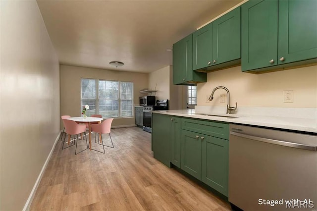 2938 Oregon Ave, Granite City, IL 62040 - kitchen featuring appliances with stainless steel finishes, green cabinetry, light countertops, and light wood-style flooring