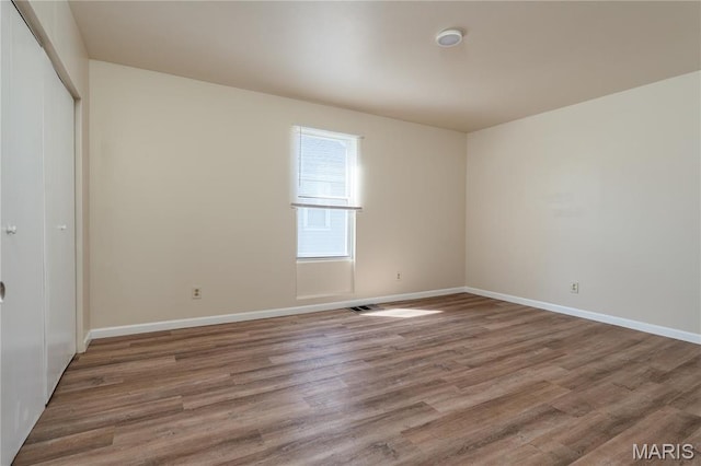 2938 Oregon Ave, Granite City, IL 62040 - unfurnished bedroom with a closet and wood finished floors