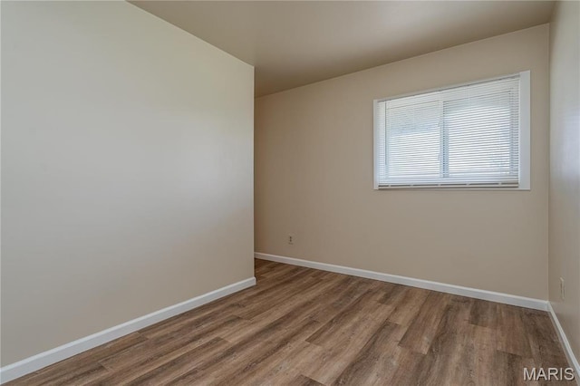 2938 Oregon Ave, Granite City, IL 62040 - spare room with wood finished floors and baseboards