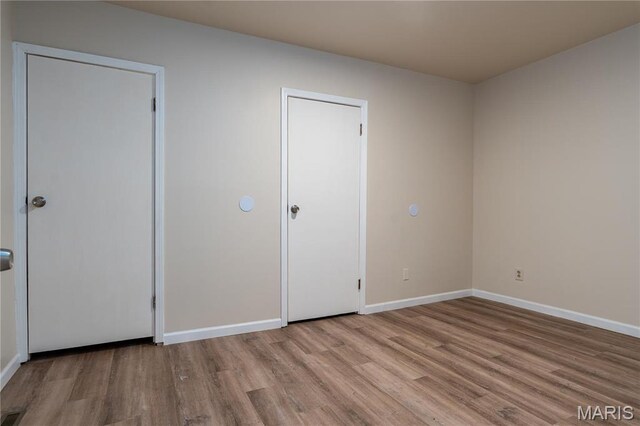 2938 Oregon Ave, Granite City, IL 62040 - unfurnished bedroom with wood finished floors