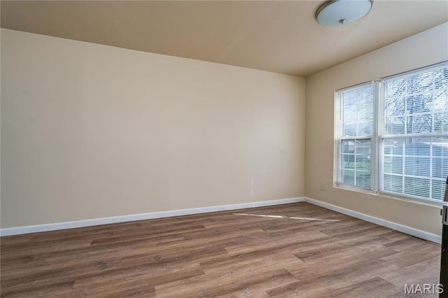 2938 Oregon Ave, Granite City, IL 62040 - spare room featuring baseboards and wood finished floors