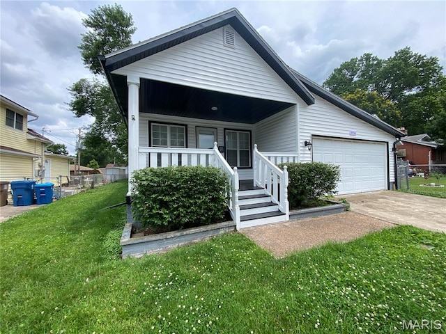 2938 Oregon Ave, Granite City, IL 62040 - view of front facade with a porch, driveway, and an attached garage