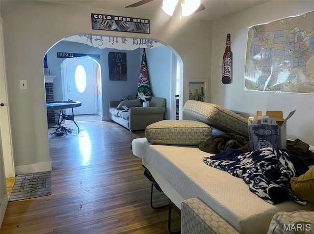 709 E 10th St, Rolla, MO 65401 - bedroom with arched walkways, wood finished floors, and ceiling fan
