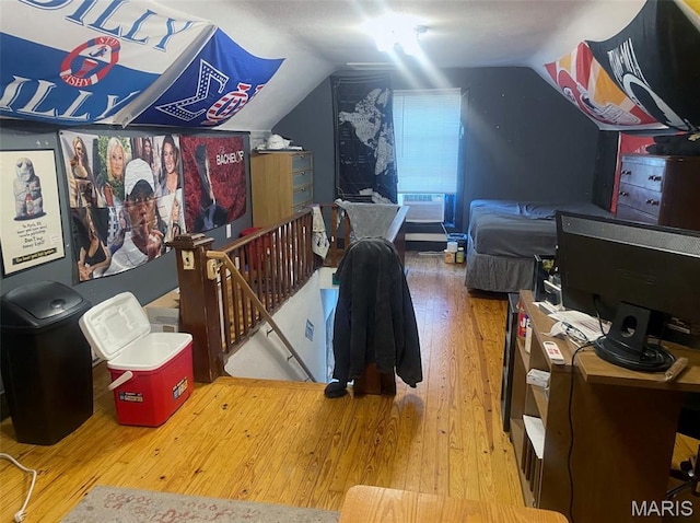 709 E 10th St, Rolla, MO 65401 - additional living space featuring hardwood / wood-style floors and vaulted ceiling