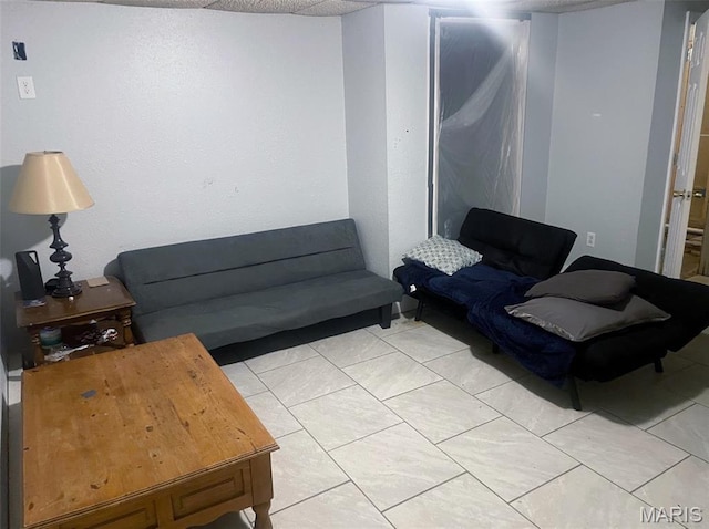 709 E 10th St, Rolla, MO 65401 - living room featuring light tile patterned floors