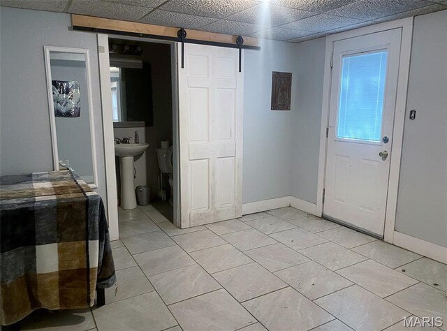 709 E 10th St, Rolla, MO 65401 - foyer entrance with a barn door and baseboards