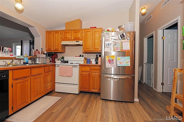 301 Kimberly Dr, Scott City, MO 63780 - kitchen featuring freestanding refrigerator, electric range, under cabinet range hood, black dishwasher, and light wood finished floors