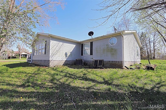 301 Kimberly Dr, Scott City, MO 63780 - rear view of house with central AC, a lawn, and crawl space