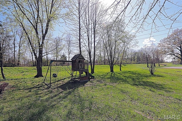 301 Kimberly Dr, Scott City, MO 63780 - view of green lawn featuring a playground