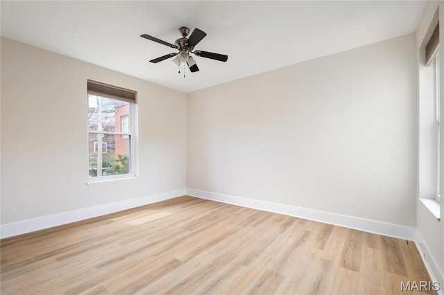 6026 Waterman Blvd Unit 1W, Saint Louis, MO 63112 - unfurnished room with light wood-type flooring, baseboards, and a ceiling fan