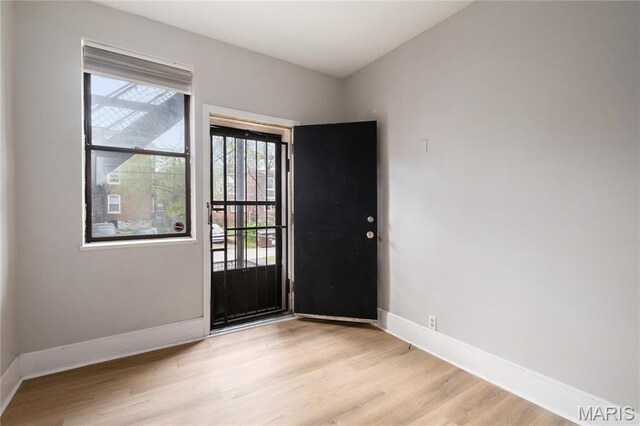 6026 Waterman Blvd Unit 1W, Saint Louis, MO 63112 - entrance foyer with baseboards and light wood-type flooring