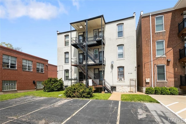 6026 Waterman Blvd Unit 1W, Saint Louis, MO 63112 - view of apartment building / complex with uncovered parking