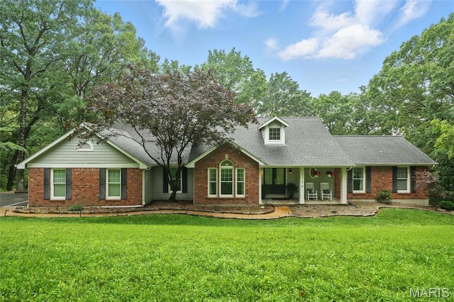 2139 Mint Spring Ln, Wildwood, MO 63038 - view of front of home with brick siding, a front lawn, covered porch, and roof with shingles