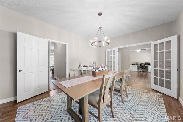 11 Country Crossing Estates Dr, Saint Peters, MO 63376 - dining area featuring french doors, a chandelier, wood finished floors, and a desk