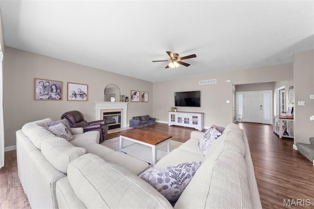 11 Country Crossing Estates Dr, Saint Peters, MO 63376 - living area with ceiling fan, wood finished floors, and a fireplace with flush hearth
