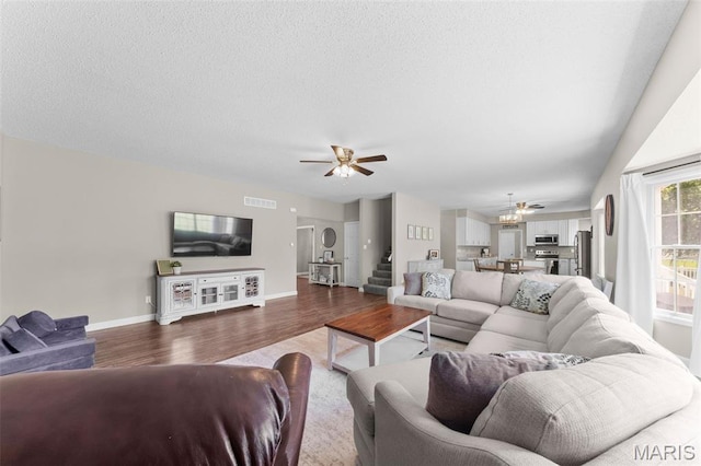 11 Country Crossing Estates Dr, Saint Peters, MO 63376 - living room featuring wood finished floors, ceiling fan, and stairway