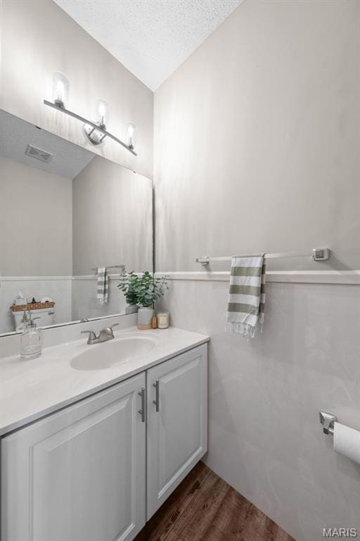 11 Country Crossing Estates Dr, Saint Peters, MO 63376 - bathroom with vanity, wood finished floors, and a textured ceiling