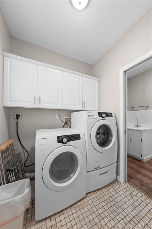 11 Country Crossing Estates Dr, Saint Peters, MO 63376 - laundry area featuring cabinet space and washing machine and clothes dryer