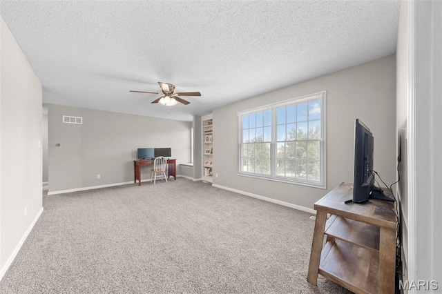 11 Country Crossing Estates Dr, Saint Peters, MO 63376 - unfurnished room with a textured ceiling, ceiling fan, carpet, and a desk