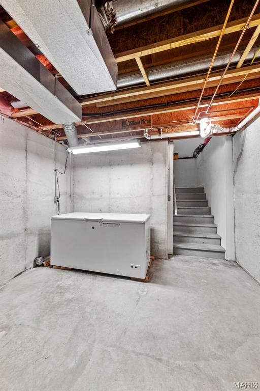 11 Country Crossing Estates Dr, Saint Peters, MO 63376 - unfinished below grade area featuring refrigerator and stairs